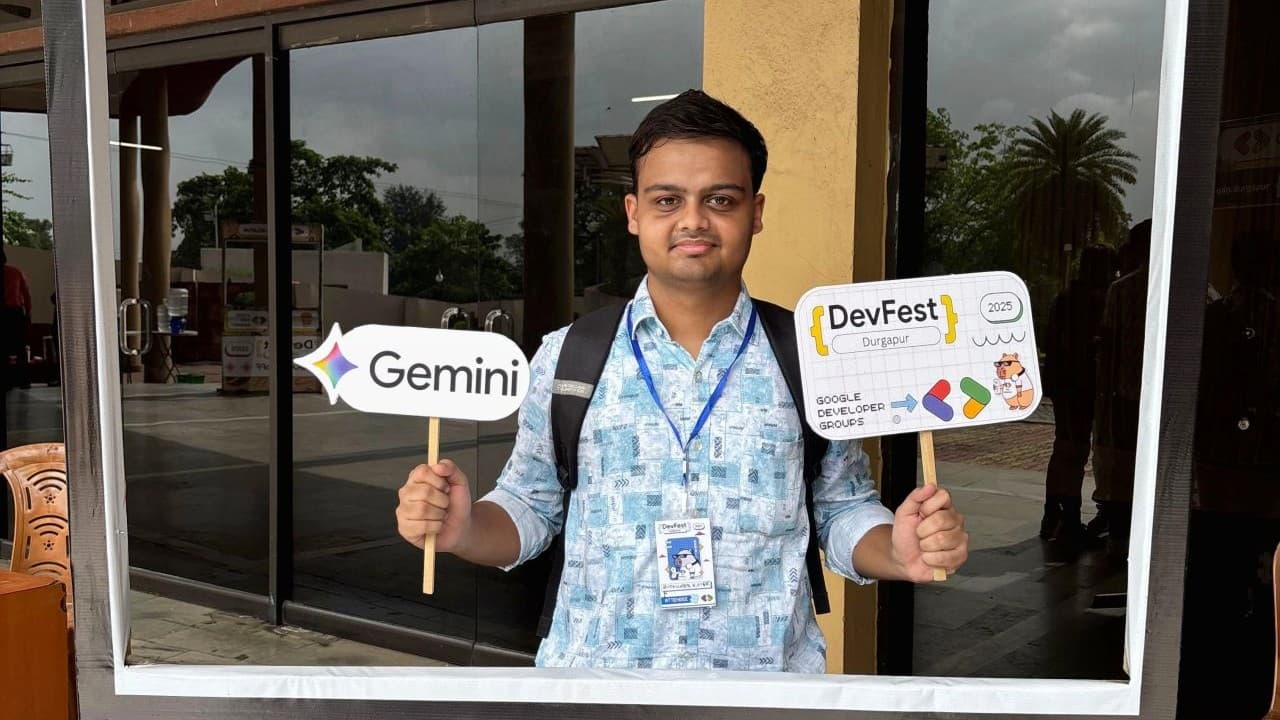 Buddhadeb Koner holding Gemini banner at GDG Durgapur event